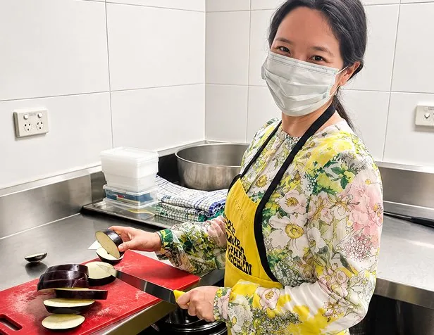Key Pharmaceuticals team member volunteering in a kitchen